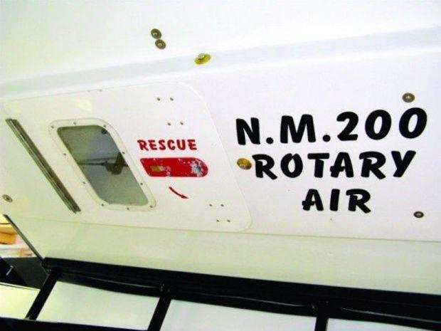 The escape hatch below the cockpit and between the sponsons on the Special. The number tells rescuers the identity of the boat. "ROTARY" identifies the type of latch on the drivers harness and "AIR" tells them the driver has an air bottle with approximately 30 minutes of air.