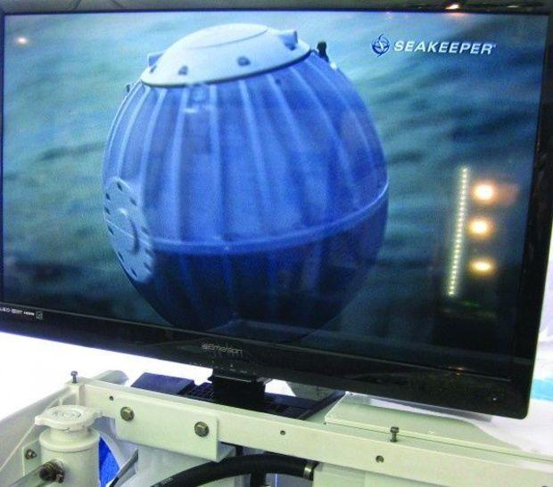 U.S. Powerboat Show goers watched a video about the Seakeeper to learn how it stabilizes a boat under way.