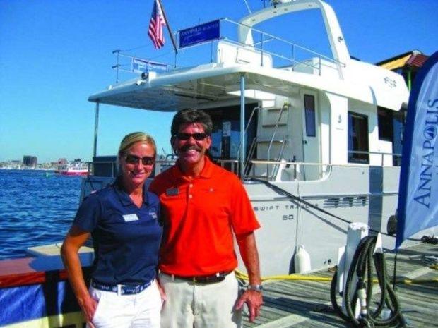A couple of Annapolis Yacht Sales friends in front of a Swift 50 Trawler.