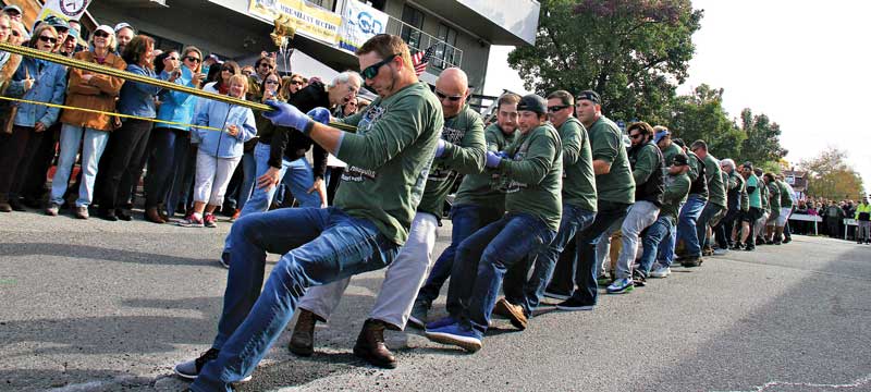 The Eastport vs. Annapolis Tug of War will warm up your muscles! Photo by Craig Ligibel