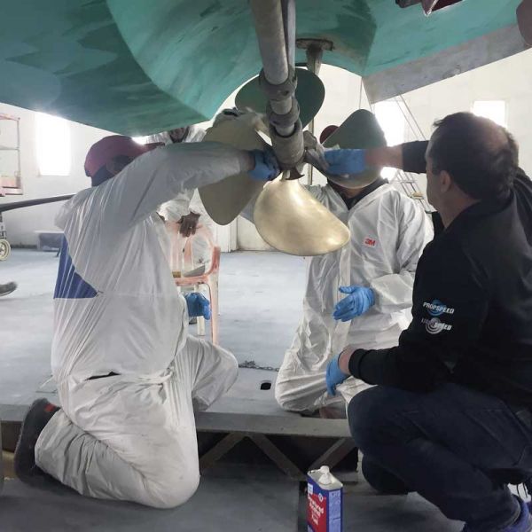 The crew at Hartge Yacht Harbor in Galesville, MD, applying Propspeed anti-fouling coating to a propeller.