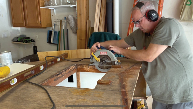 Henn at work creating nautical art.