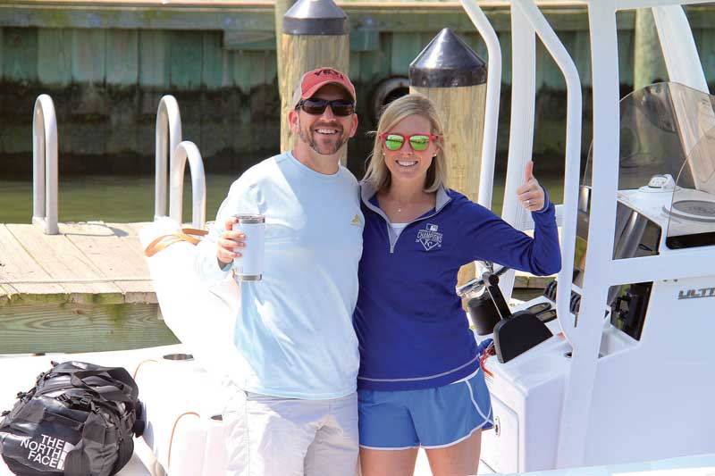 Happy new boat owners aboard their 234 Sea Hunt Ultra.