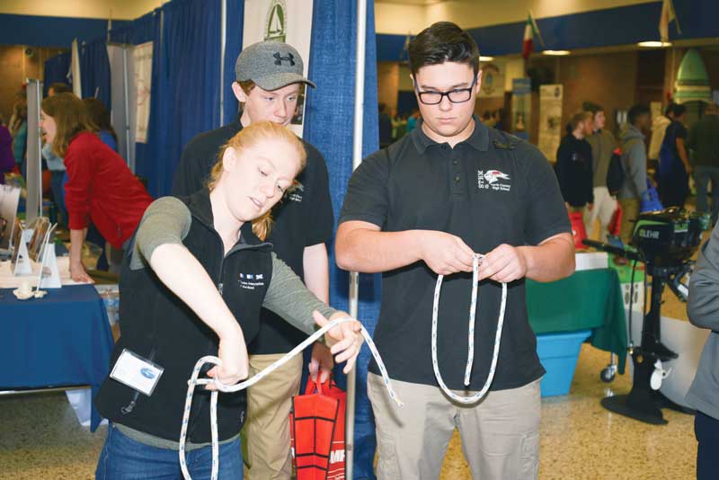 Students at the Marine and Maritime Career Expo do some knot tying, as they learn about maritime career opportunities. Photo by Tony Tarsia/ EYCF