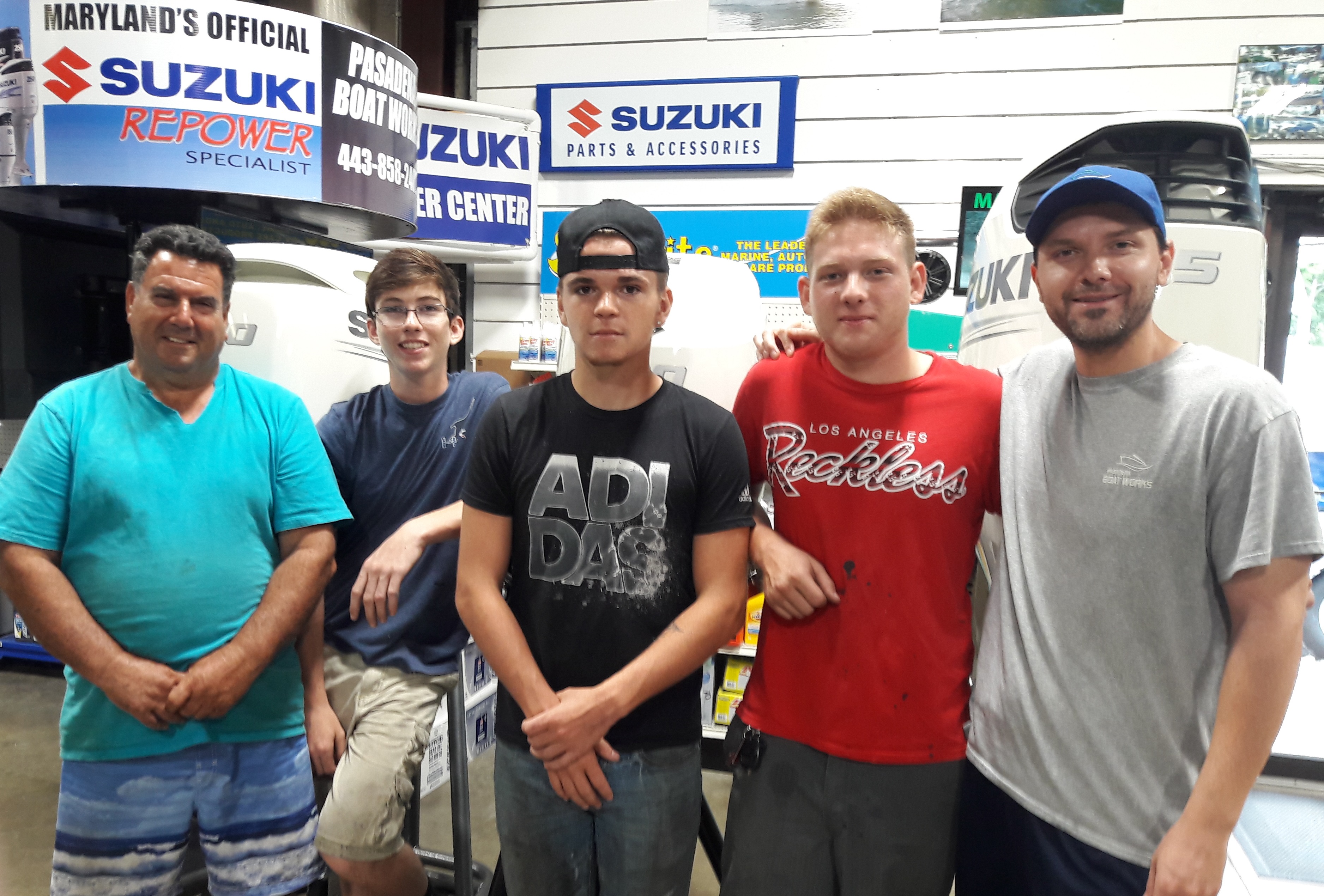 Dawson Combs (second from the left), Dylan Barclay (center), and Garrett Tate (second from the right) with supervisor Mario (left) and Pasadena Boat Works Manager, Nick Doetsch (right).