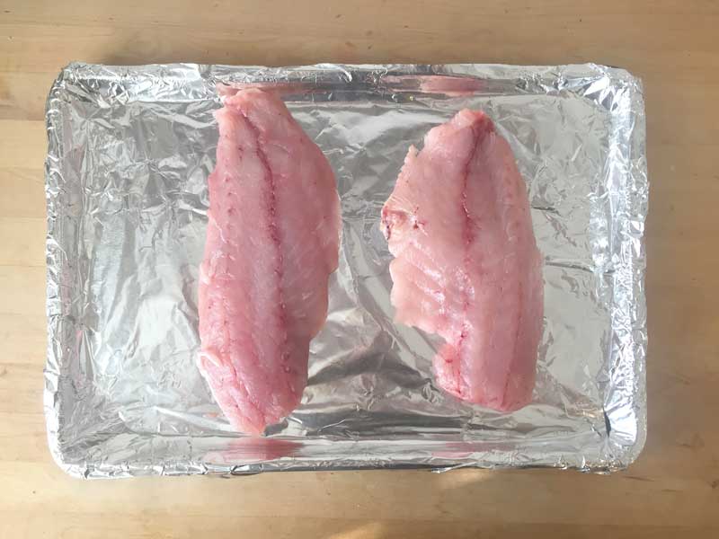 Place fillets on baking sheet.