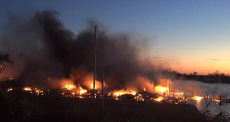 Photo by Beth Justice. Justice lives near the marina and called 911 when she saw the flames from her home. Photo by Beth Justice. Justice lives near the marina and called 911 when she saw the flames from her home.