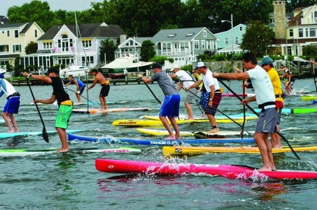 Paddlers battling it out at last year's Chesapeake Stand Up Challenge in Annapolis. This year's event, presented by East of Maui and EYC, takes place July 9.