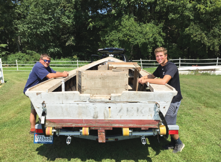 John and his son Jack with their project boat. Photos by Kirsten Elstner John and his son Jack with their project boat. Photos by Kirsten Elstner