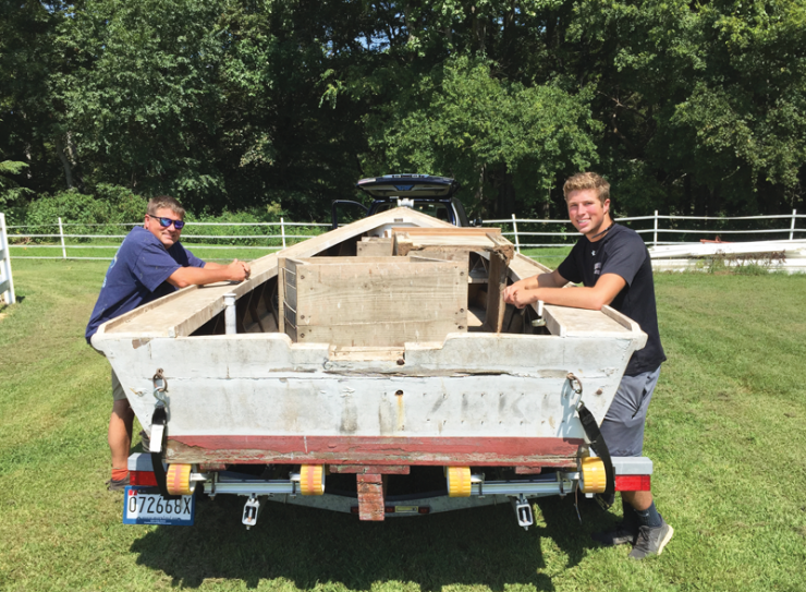 John and his son Jack with their project boat. Photos by Kirsten Elstner