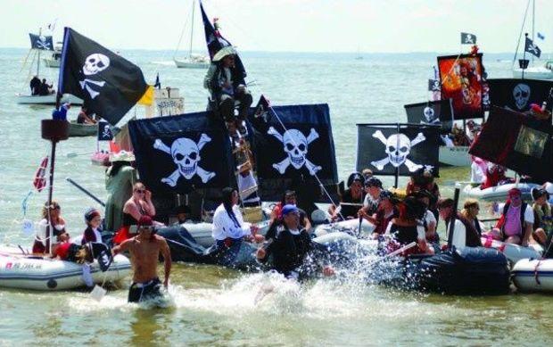 Pirate dinghies come ashore. Photo by Bernadette Van Pelt