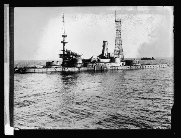 The ex-Indiana (BB-1) sunk near Tangier Island, VA. The wreck of the San Marcos is in the right background. Photo taken between 1920 and 1921, courtesy of the Library of Congress, National Photo Company Collection