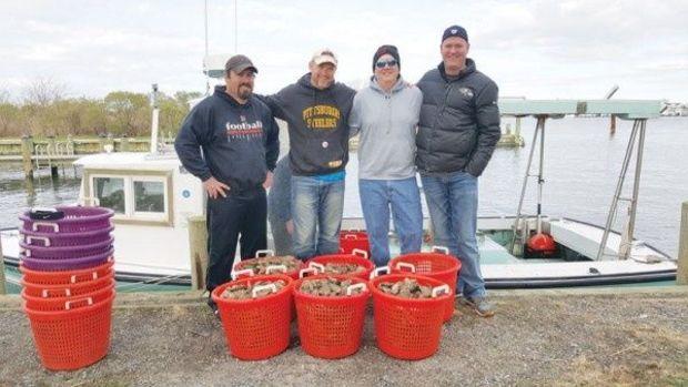 A succesful oyster dive for divers Ryan Bidle, Scott Farrow, John Harman, and Erik Fulwider. Photo courtesy of Atlantic Edge Scuba. A succesful oyster dive for divers Ryan Bidle, Scott Farrow, John Harman, and Erik Fulwider. Photo courtesy of Atlantic Edge Scuba.