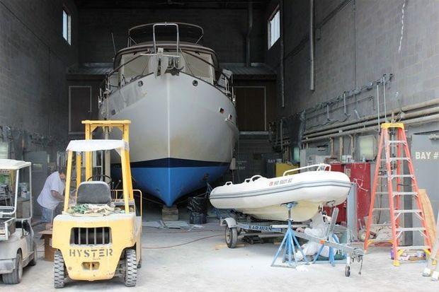 A busy day in the shop at Osprey Composites in Tracys Landing, MD. The Kadey-Krogan 43 is in for some core replacement and her tender is having her bottom repaired. Photo by Rick Franke