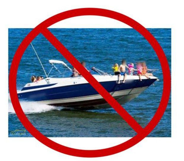 NEVER permit passengers to ride on the bow, gunwale, transom, seat backs, or other locations where they might fall overboard while the boat is underway. Photo courtesy MD DNR