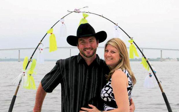 We love this photo of Dana (Wright) Tippett and Captain Lee Tippett, owner of <em>Fin Finder II</em>. The couple married aboard <em>Fin Finder II</em> on the Patuxent River in Solomons, MD, in 2014.