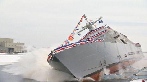 The future USS Sioux City (LCS 11) is launched into the Menominee River. LCS 11 is the first naval vessel to be named in honor of Sioux City, Iowa. (U.S. Navy photo by Lockheed Martin/Released)