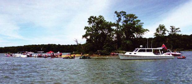 The West-Rhode Riverkeeper has requested boaters to not beach their boats on Flat Island in the Rhode River but rather raftup nearby. Photo by Jeff Holland The West-Rhode Riverkeeper has requested boaters to not beach their boats on Flat Island in the Rhode River but rather raftup nearby. Photo by Jeff Holland