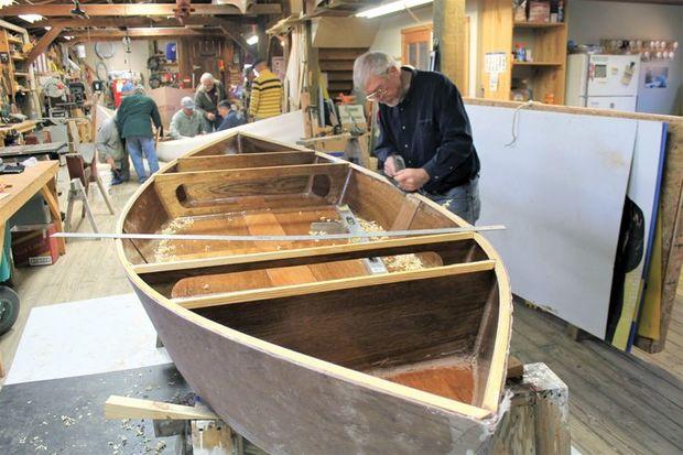 Patuxent Small Boat Guild volunteer Ed Bahniuk preparing an Adirondack guide boat for decking in the shop at Calvert Marine Museum in Solomons, MD.