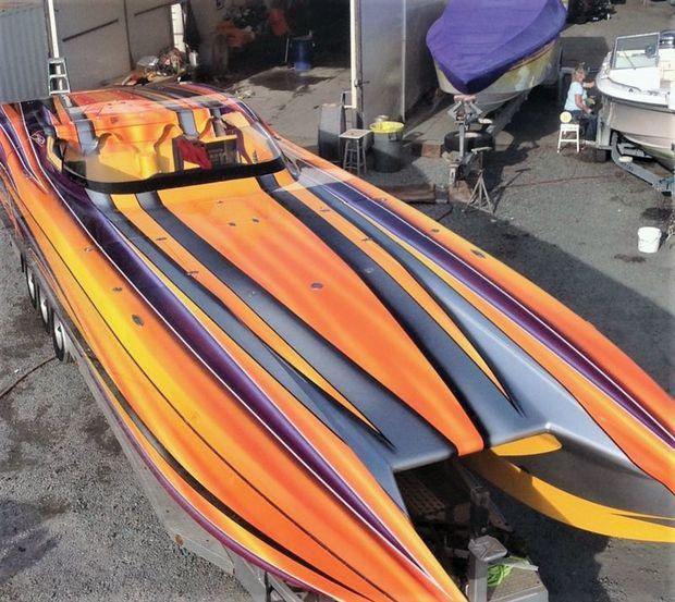 A custom paint scheme on a 2009 MTI power cat emerges from the paint shop at Lilly Sport Boats in Arnold, MD.