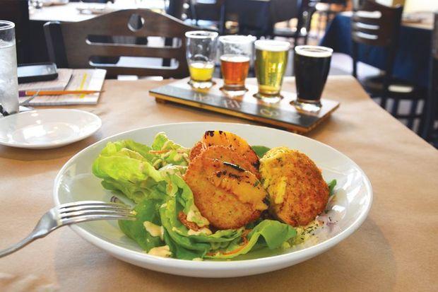 Bib salad with fried green tomatoes and a crab cake at High Spot Gastropub.