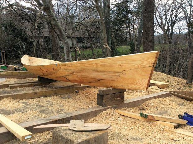 Eve, a 20-foot, five-log, Tighlman-style racing canoe being built by John Cook of Hollywood, MD, takes shape in his backyard. Photo by John Cook