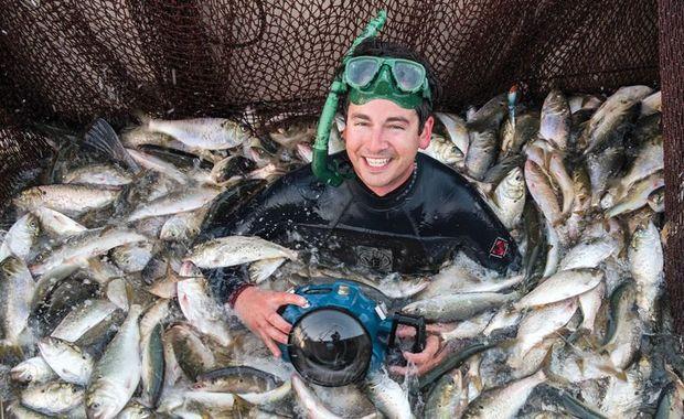 The photographer in a pound net. Photo courtesy Jay Fleming