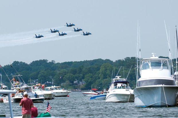 For USNA Commissioning Week, the Blue Angels fly over the party that's formed in Annapolis Harbor to watch. Photo by Dan Phelps