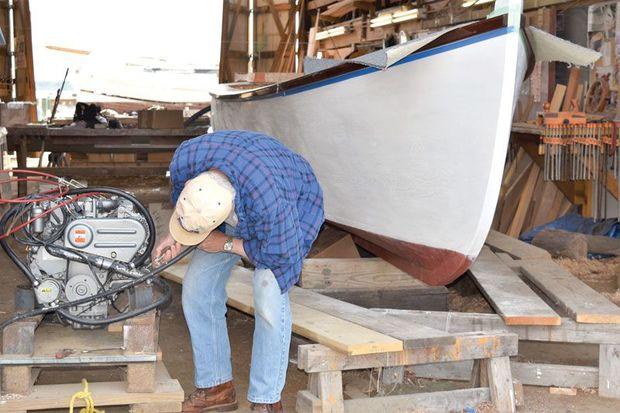 Pintail’s two-cylinder Yanmar diesel engine being readied for installation in the 25-foot draketail at the Chesapeake Bay Maritime Museum shop in St. Michaels, MD.