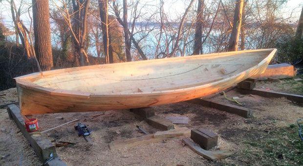 The 20-foot five log canoe Eve’s hull is now complete. The topsides are built up with planks and chunks of wood in John Cook’s back yard in Hollywood, MD.