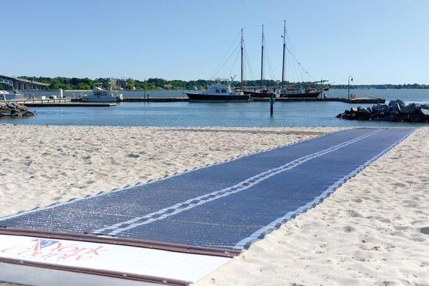 The town recently installed a Mobi mat on the beach by Riverwalk Landing to allow wheeled vehicles access. The town recently installed a Mobi mat on the beach by Riverwalk Landing to allow wheeled vehicles access.