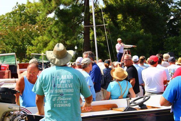 The live auction begins at 11 a.m. with boats on land and on water.