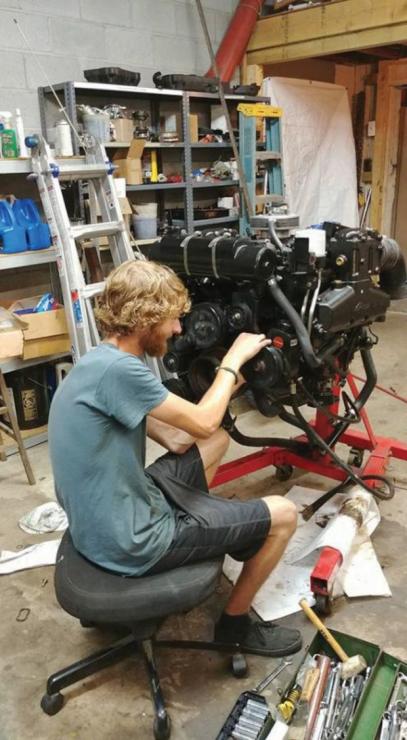 At the Baltimore Boating Center Marina, intern Hayden Foy is making sure engines are working perfectly. Photo courtesy of MTAM