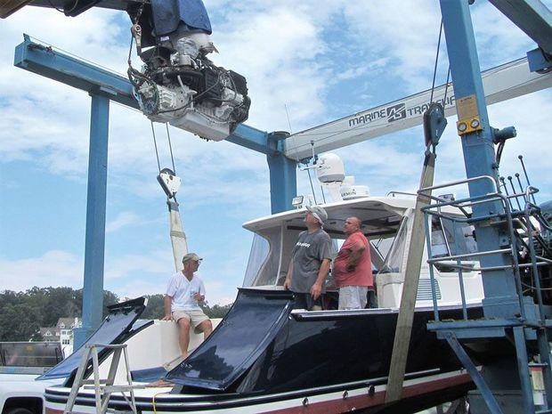 A Volvo Penta D6-4351A, 435-hp diesel being removed from a True North 34 by the crew from Hartge Yacht Yard in Galesville, MD.
