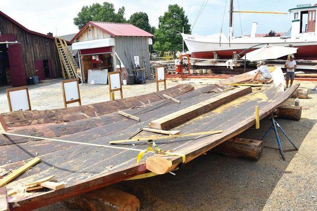 The new hull sits next to the 1889 bugeye Edna E. Lockwood, in preparation for the fall, when CBMM shipwrights will move over her existing topsides and begin to marry the two.