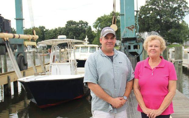 Billy and his mother Jane in front of their 50-ton Travelift.