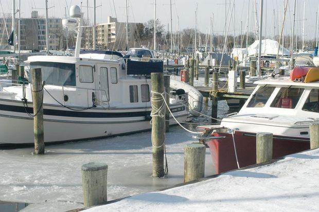 Whether or not you leave your boat in the water for the winter depends on your boat and your insurance policy. Check your policy to be sure you're covered.