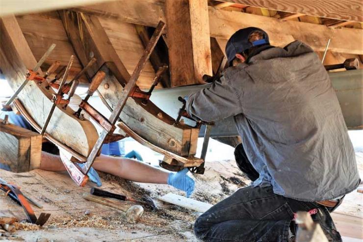 Shipwrights and apprentices at the Chesapeake Bay Maritime Museum in St. Michaels, MD, are hard at work on the historic restoration of Edna Lockwood.