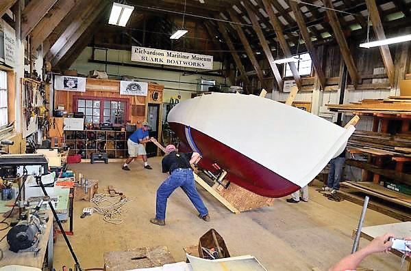Turning the completed hull of Miss Polly in the Ruark Boatworks shop at Richardson Maritime Museum in Cambridge, MD. Turning the completed hull of Miss Polly in the Ruark Boatworks shop at Richardson Maritime Museum in Cambridge, MD.