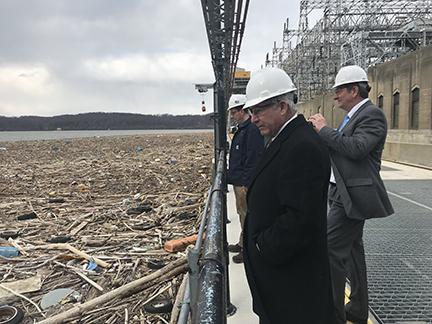 Exelon's Bryan Bennett, McCarthy, and Wein survey the refuse being trapped above the dam. Photos courtesy Cecil County Government