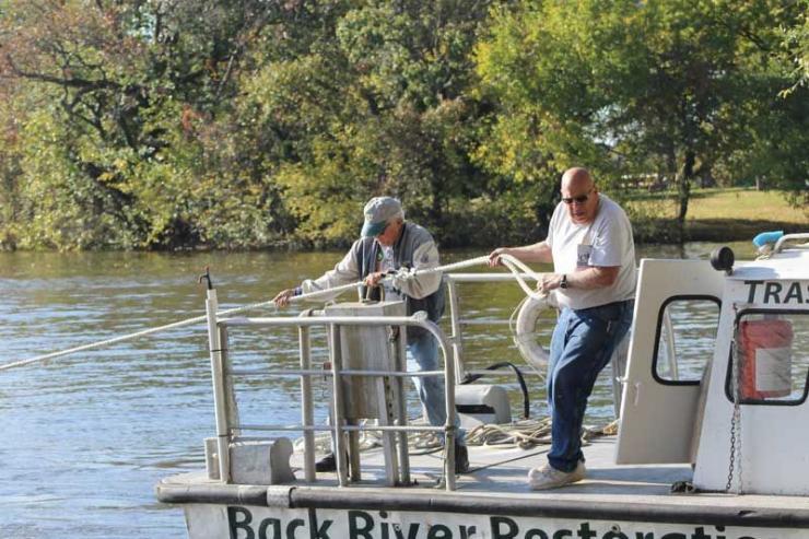 Sam Weaver (right) and volunteer Jack Hardy hauling in an abandoned boat. Photos courtesy BRRC