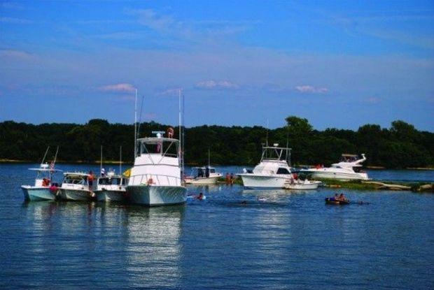 If you plan on anchoring out to beat the heat, make sure you secure a spot securely, because anchoring holes fill up quickly during the summer. Photo by Jim Christie If you plan on anchoring out to beat the heat, make sure you secure a spot securely, because anchoring holes fill up quickly during the summer. Photo by Jim Christie