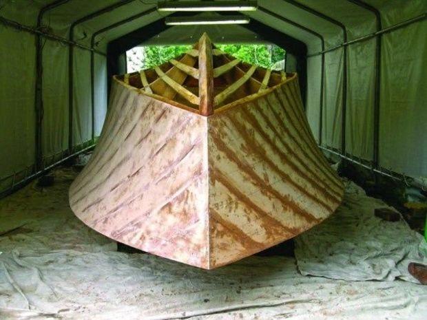 A cold-molded boat. Notice the alternating layers of wood veneers attached to the jig. Photo courtesy of John Pinchney.