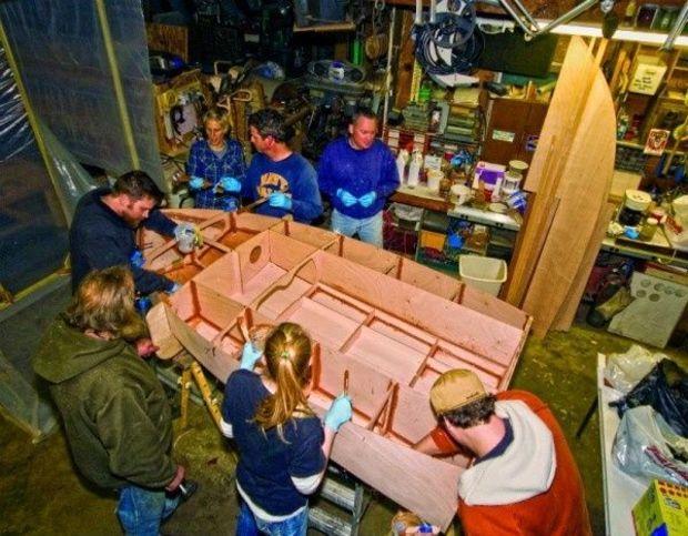 Stitch and glue construction. In this photograph the Proptalk team works on its stitch-and-glue, outbaord-powered racer. Photo by Gary Reich.