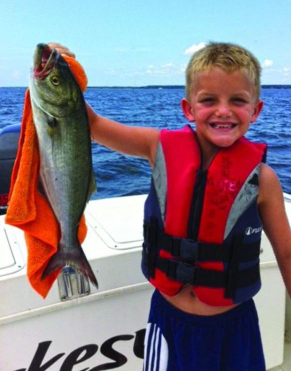 Henry Sykes of Beverly Beach, MD caught the bluefish when fishing with his dad, Jeff.