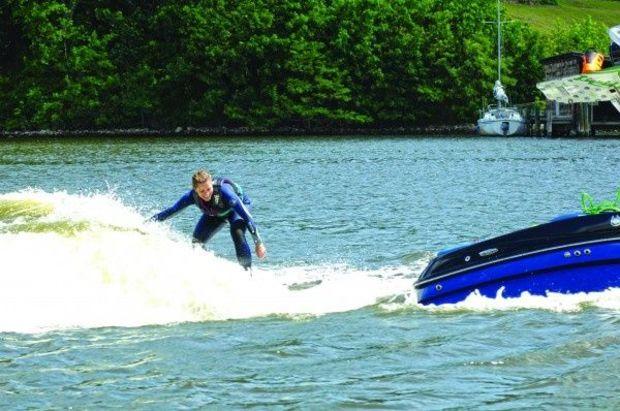 Jen Pratt surfing a wave behind the Mastercraft X30.
