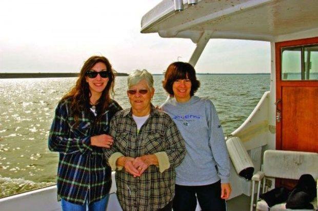 The author, her grandmother, and mother onboard the author's brother's boat.