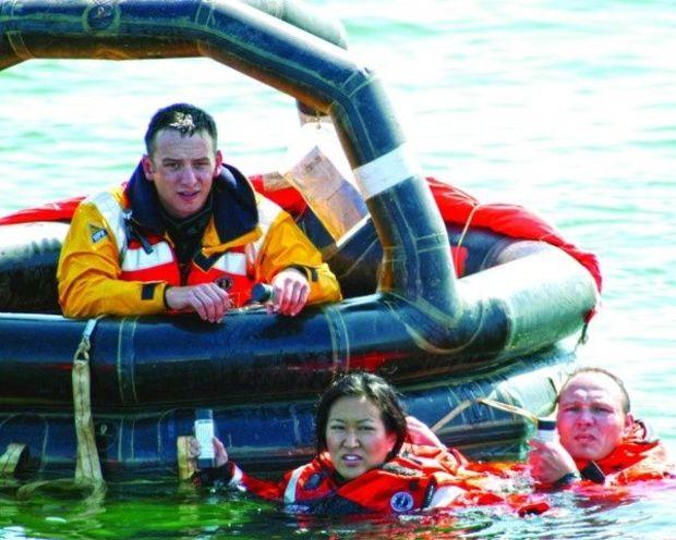 Coast Guard members practiced emergency signaling and survival techniques. USCG photo by PA3 Louis Hebert Coast Guard members practiced emergency signaling and survival techniques. USCG photo by PA3 Louis Hebert