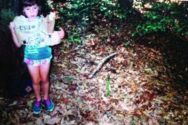 The author at the age of six holding her treasure map.