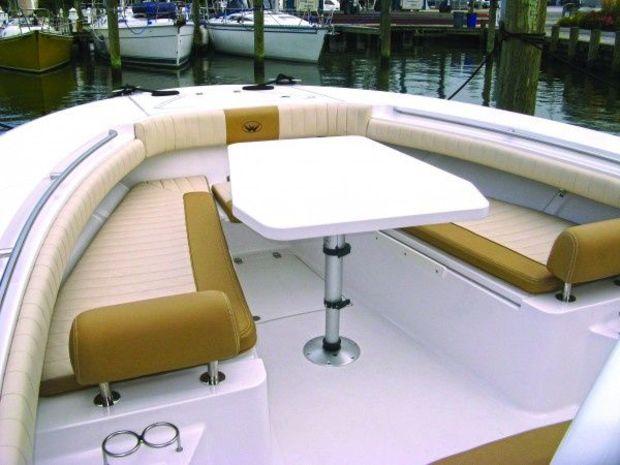 Lowering the table on the convertible dinette creates a sun lounging area. Lowering the table on the convertible dinette creates a sun lounging area.